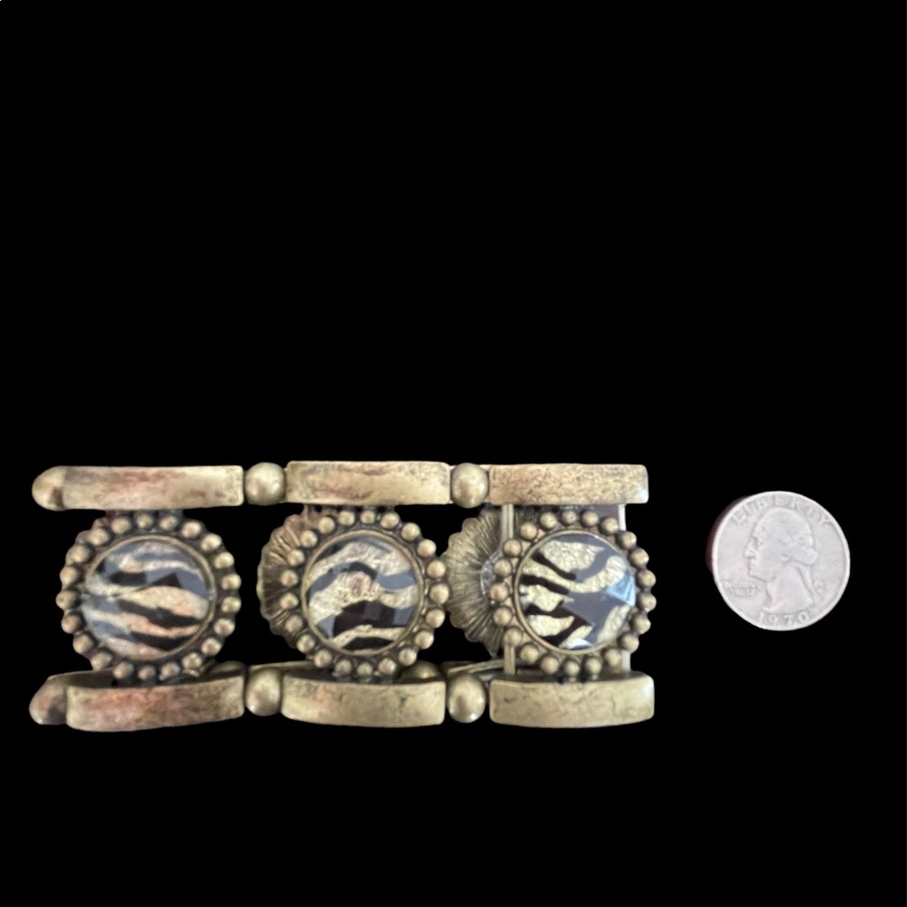 Animal print brush gold bracelet. Never worn